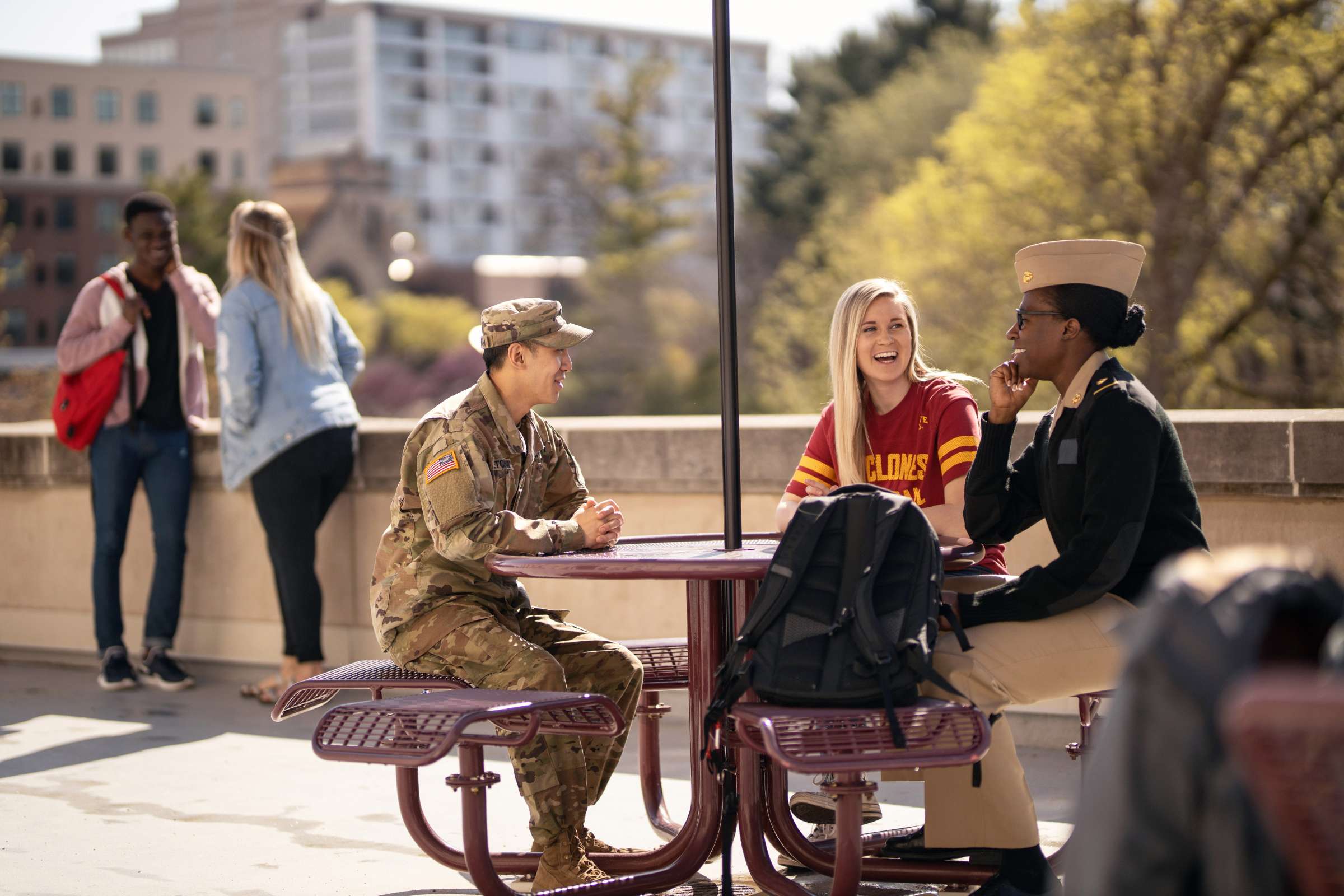 Five students sitting on the Memorial Union terrace. 
