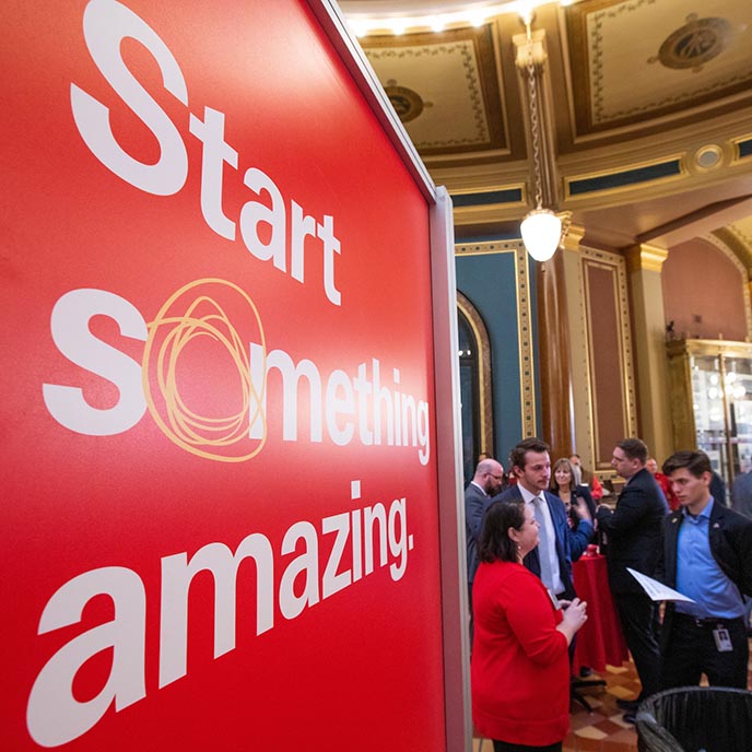 Sign promoting "Start something amazing" at the innovation display during ISU Day at the Capitol
