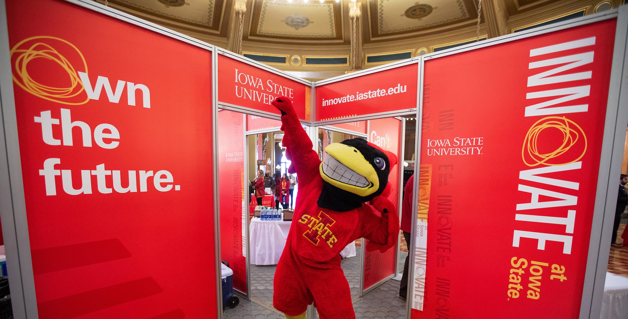 Cy mascot strikes a pose in the Iowa Capitol during ISU day