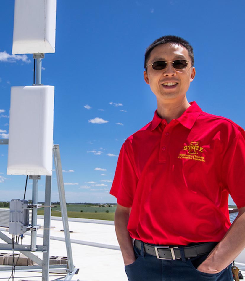 Hongwei Zhang poses outside with a broadband antennae