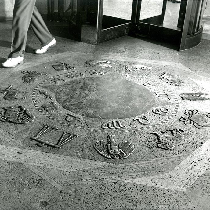 Archived black and white photo of The Zodiac floor artwork