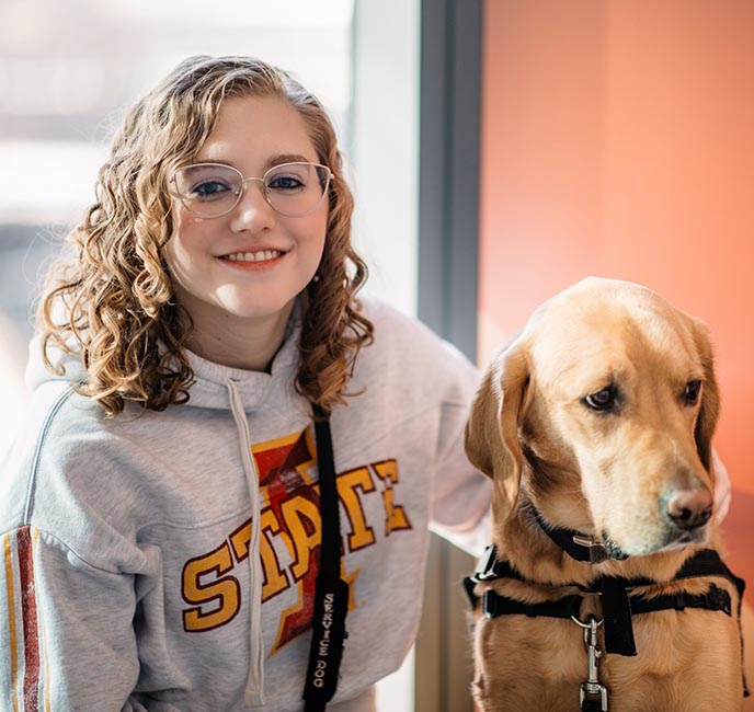 Aliya Warth poses with her dog Windsor.
