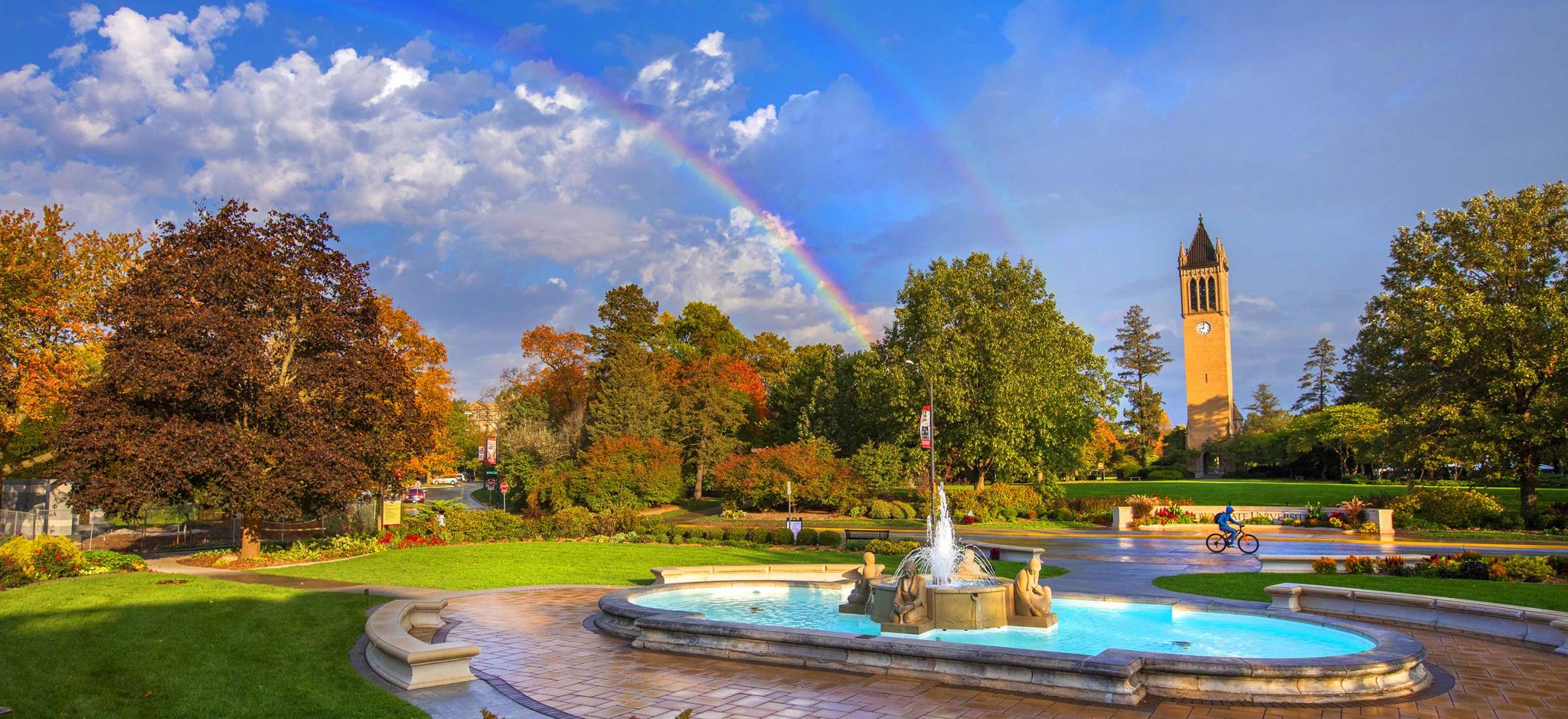 View of the fountain and campanile with a double rainbow backdrop