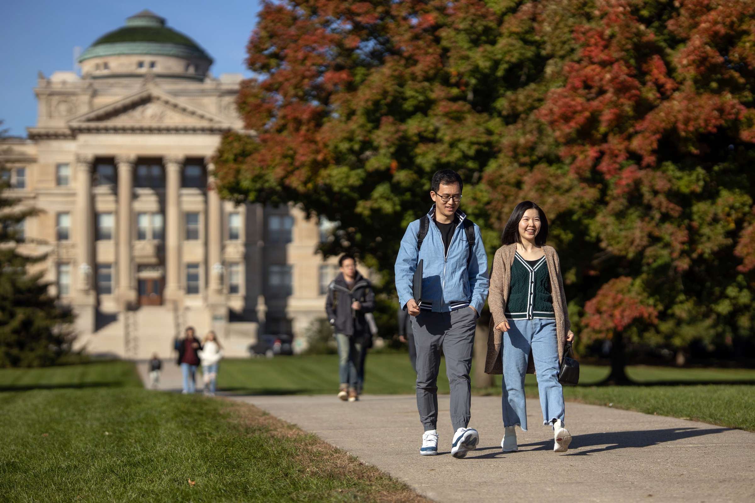 Two students walking on Central Campus