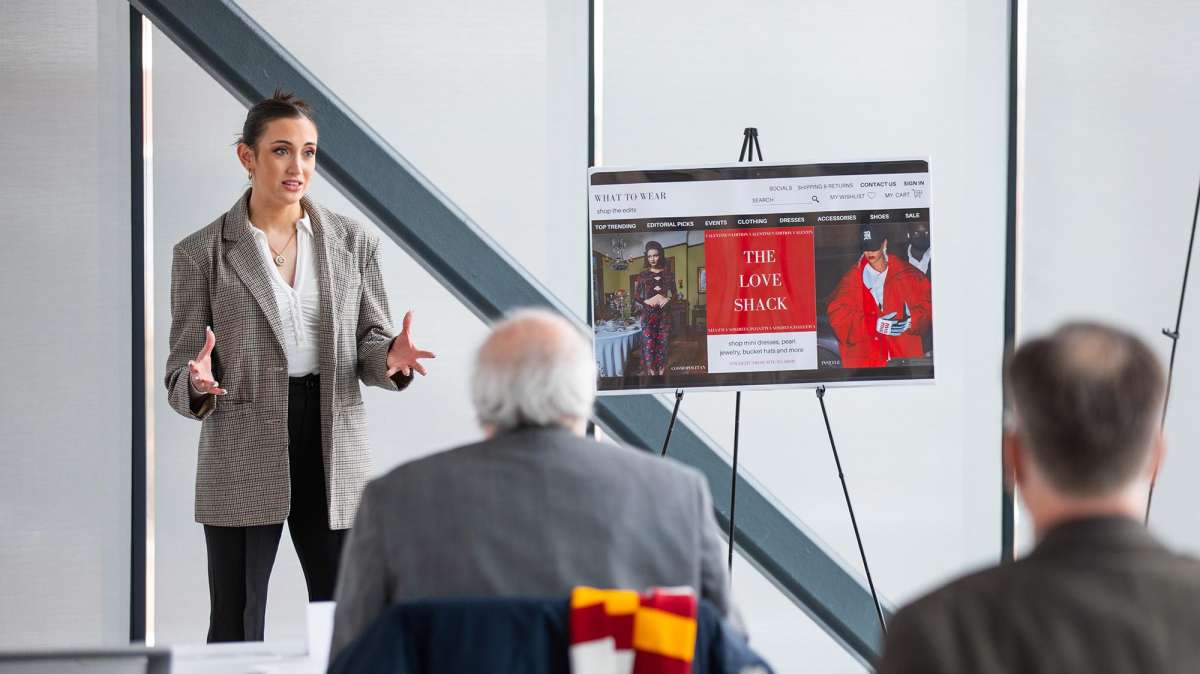 A woman presents her idea to judges during an entrepreneurial pitch competition