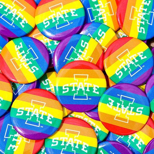 A collection of pins with rainbow colors and the Iowa State athletics logo